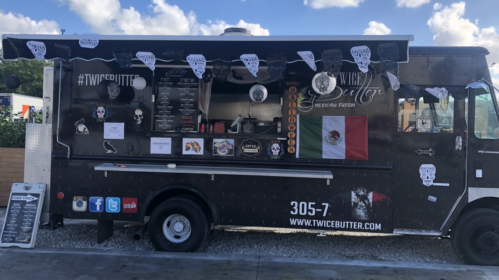 The black Twice Miami branded food truck